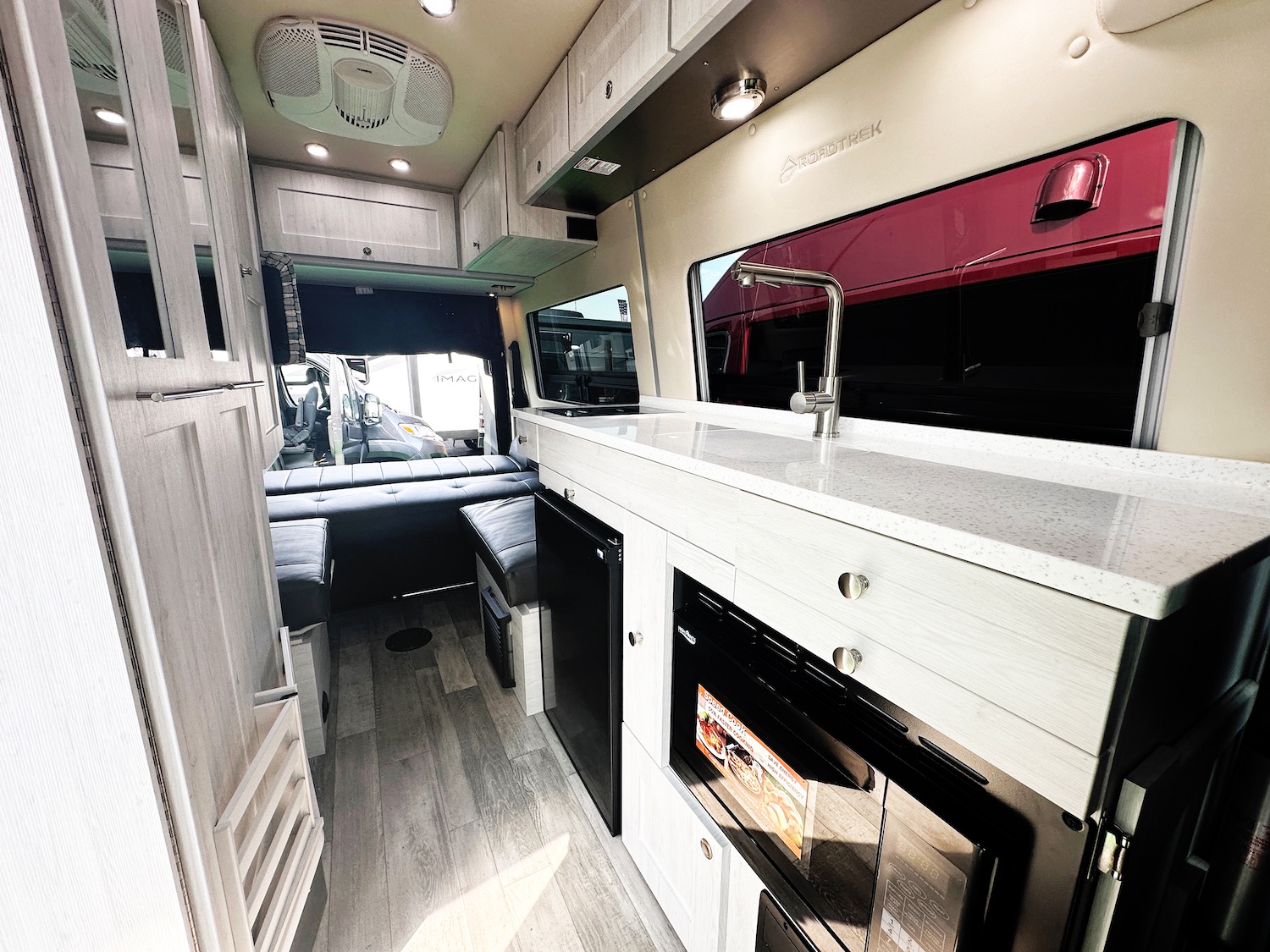 Galley and rear lounge inside a 2025 Roadtrek SS Agile